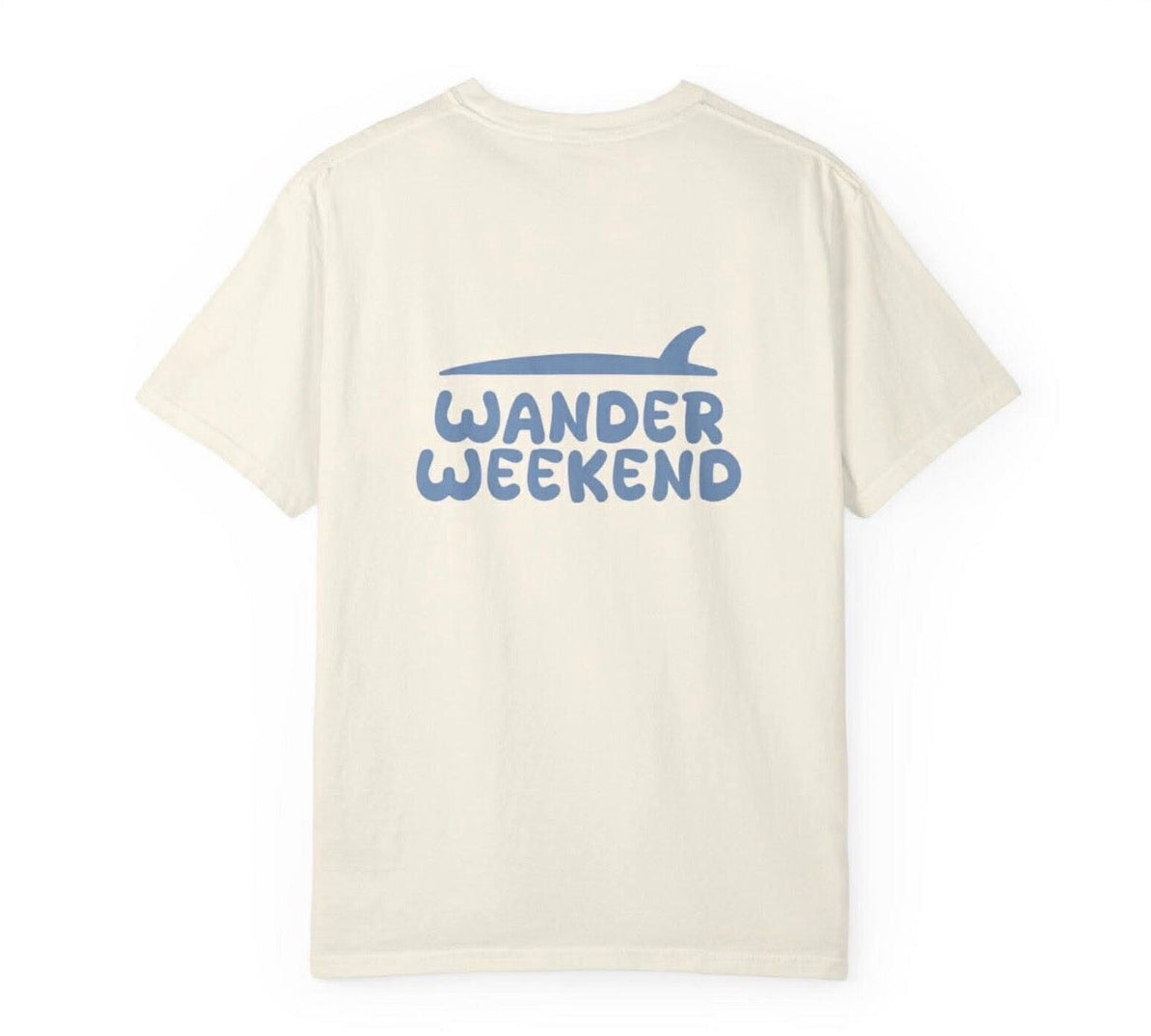 Beige t-shirt with 'Wander Weekend' text and logo on a white background